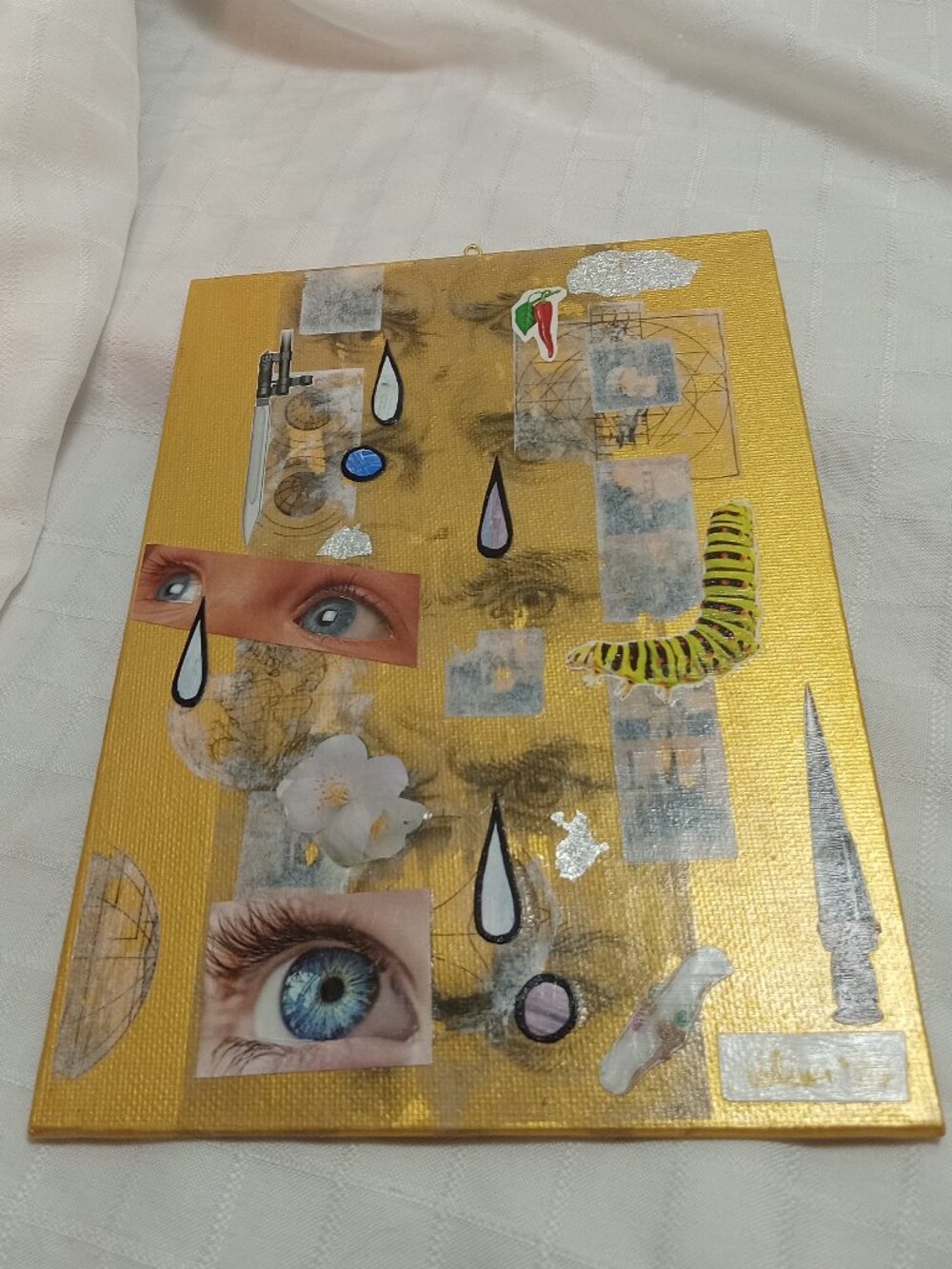 Prints of old magazines on canvas, gold paint, and mixed-media collages